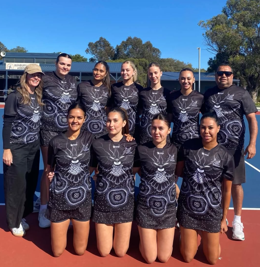 Koolbardis netball team and support crew on court wearing their black and white Dialocal Active carnival range
