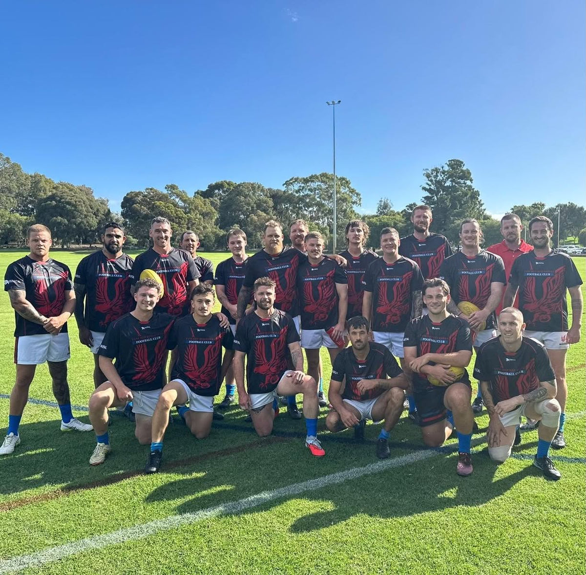 Yanchep Red Hawks players wearing their Dialocal Active training shirts